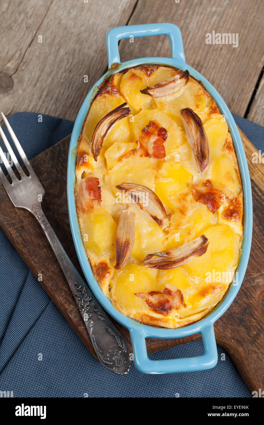 Potato casserole with bacon, parmesan cheese and onion. Stock Photo