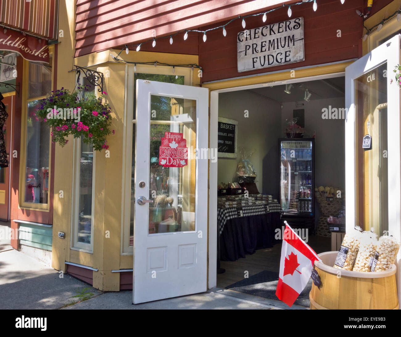 Checkers Premium Fudge Shop with doors open and decorated for Canada Day in Fort Langley, BC, Canada.  Canadian flags. Stock Photo