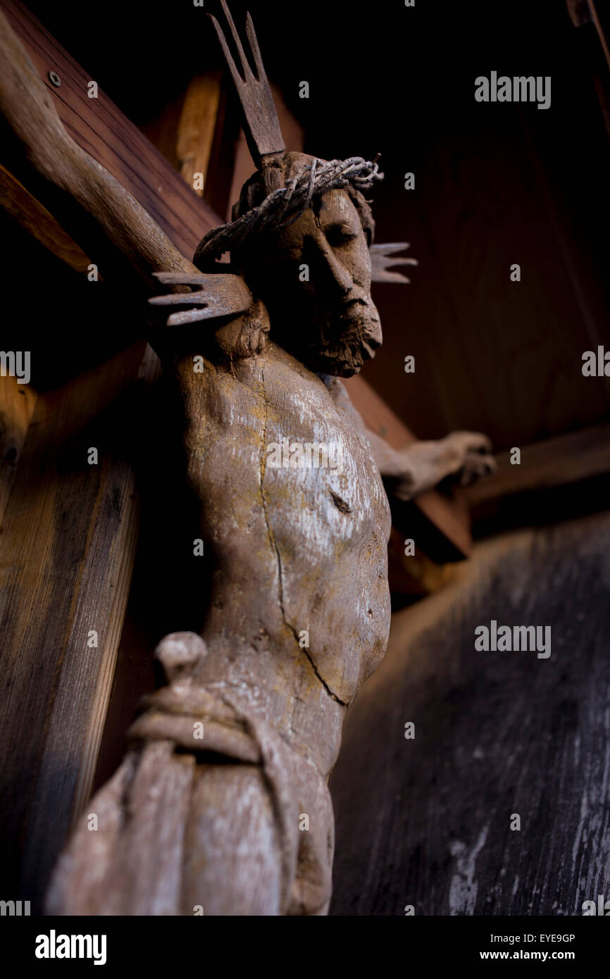 Detail of a Jesus crucifix in Pransasores, a Dolomites hamlet in south Tyrol, Italy. Stock Photo