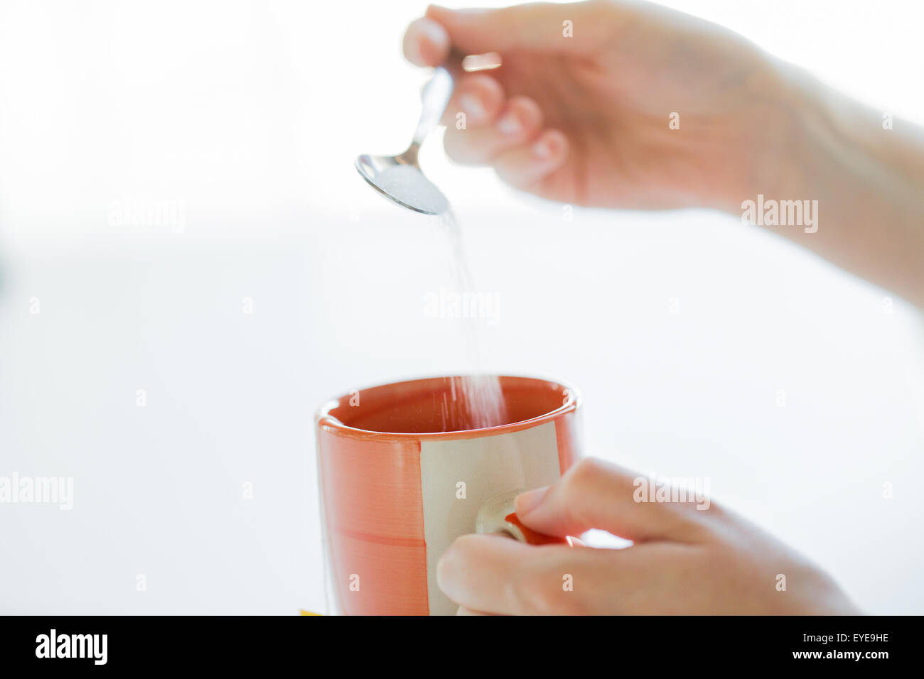 Putting sugar hires stock photography and images Alamy