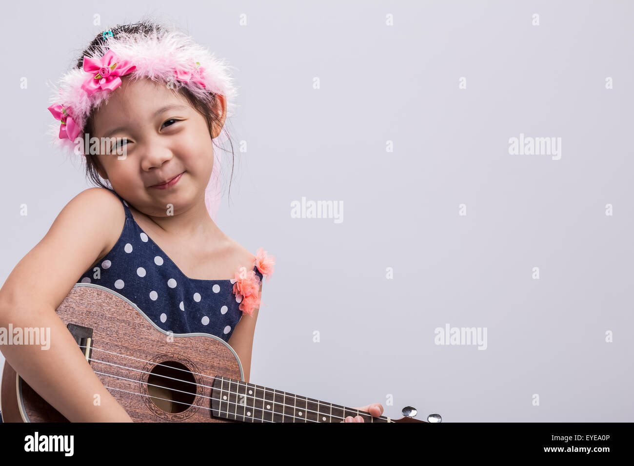 Little girl with her ukulele, string music instrument Stock Photo Alamy