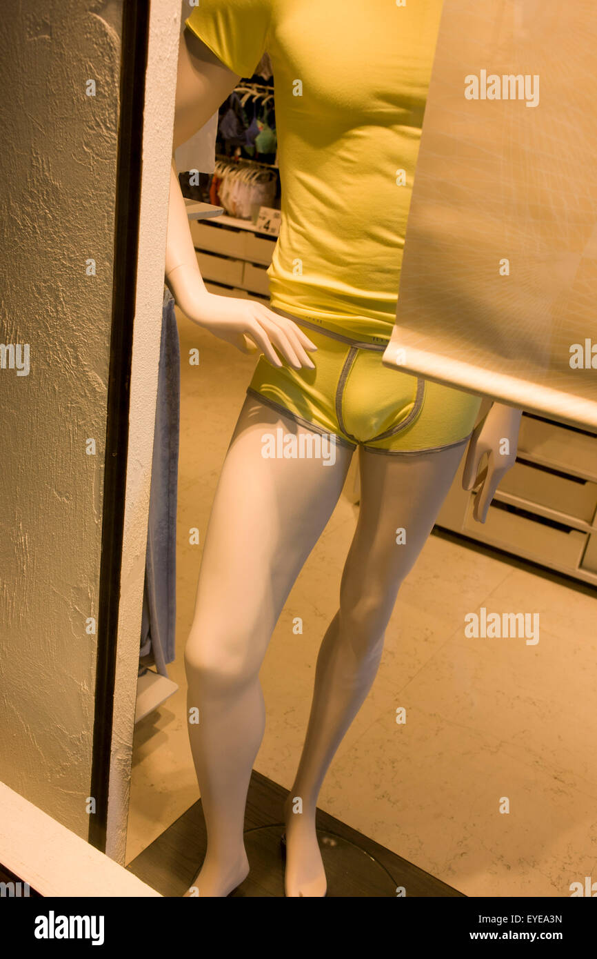 Male mannequin with hand on hip, posed in an Italian shop window. Stock Photo
