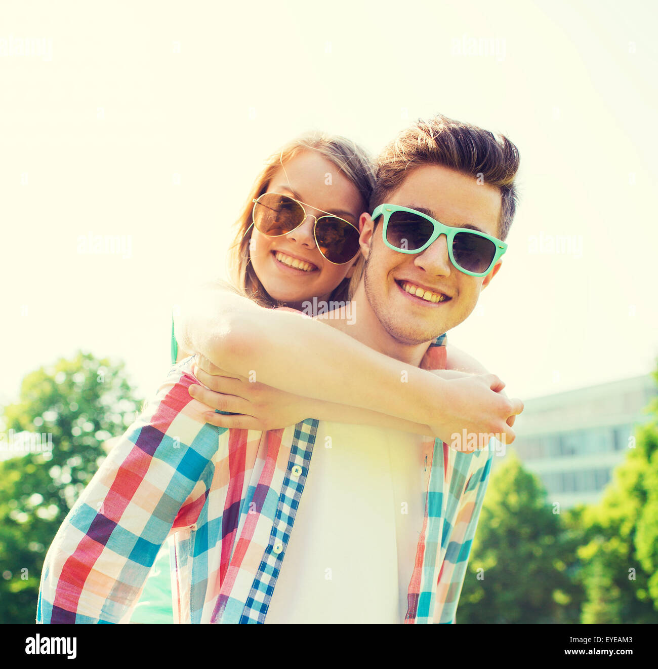 smiling couple having fun in park Stock Photo - Alamy