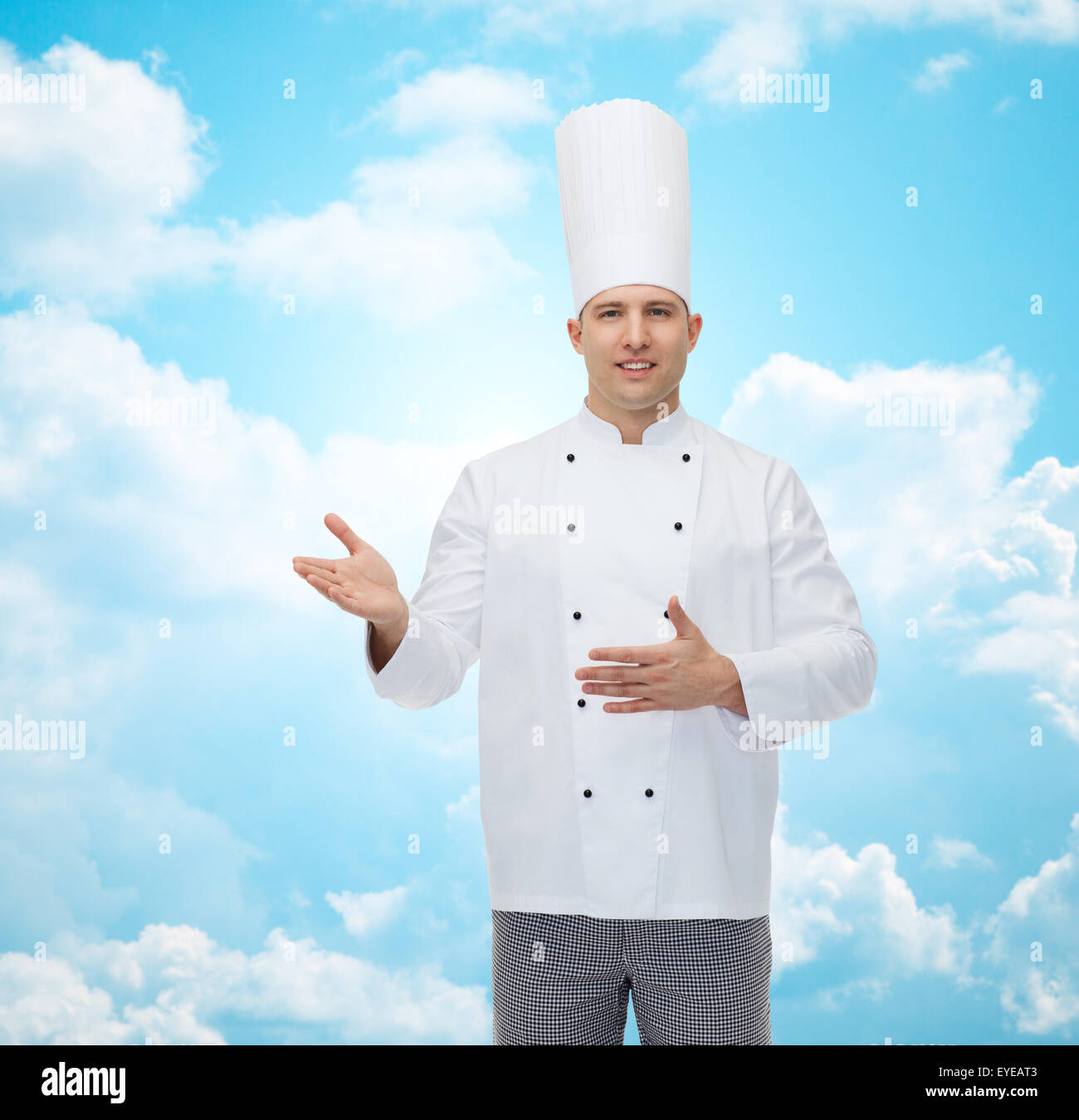 happy male chef cook inviting Stock Photo