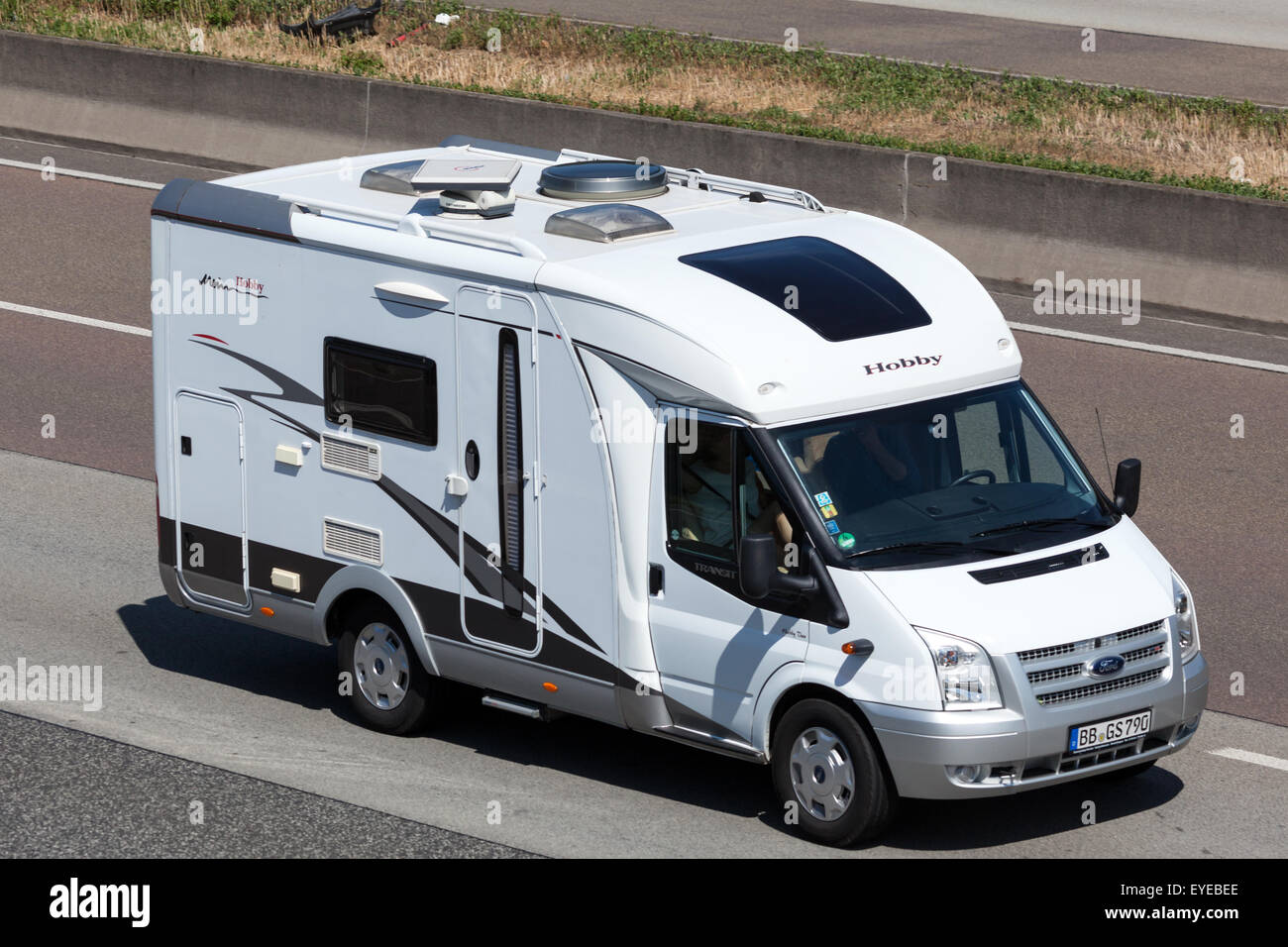 Ford Transit Hobby Mobile Home on the highway in Germany Stock Photo