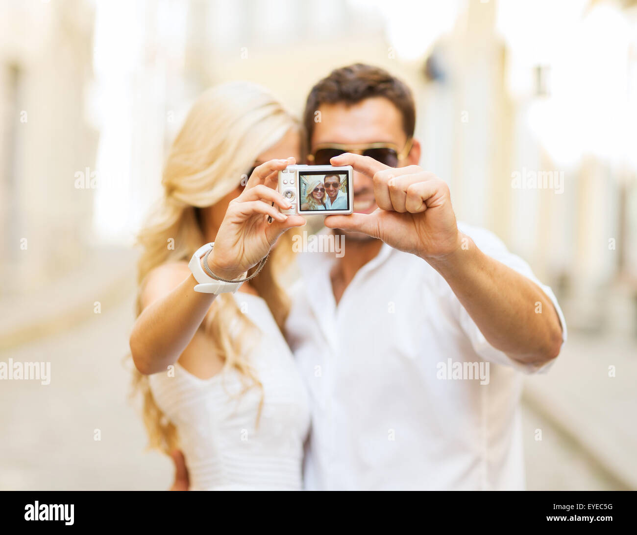 travelling couple taking photo picture with camera Stock Photo Alamy