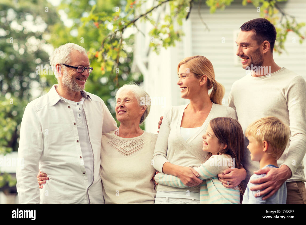 happy family in front of house outdoors Stock Photo - Alamy