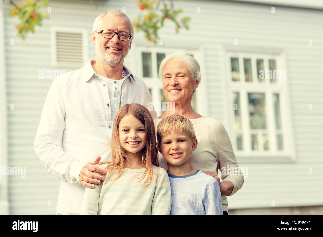 happy family in front of house outdoors Stock Photo - Alamy