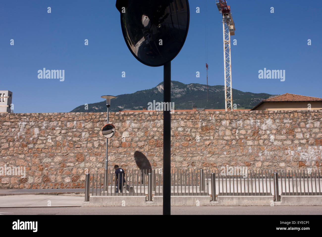 A city street sweeper tidies up a street in the northern Italian city of Trento. Stock Photo