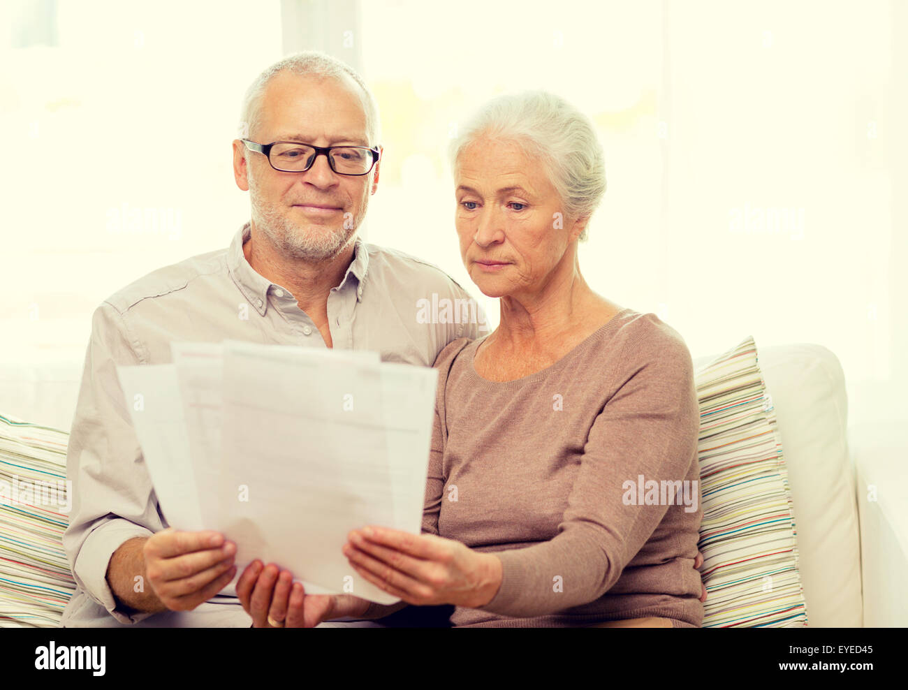 senior couple with papers at home Stock Photo