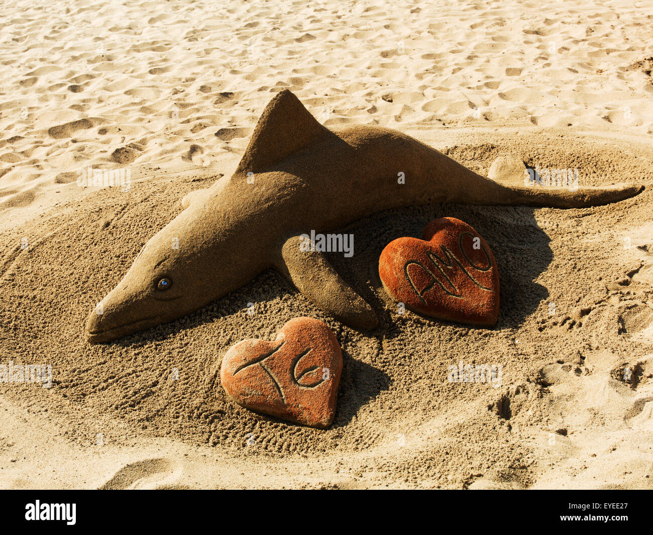 A sand sculpture of a fish with initials in heart shapes; Vina Del Mar, Valparaiso, Chile Stock Photo