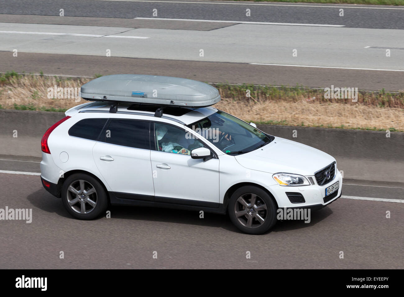 Volvo XC60 with a roof box moving fast on the highway A5 near Frankfurt. July 26, 2015 in Frankfurt Main, Germany Stock Photo
