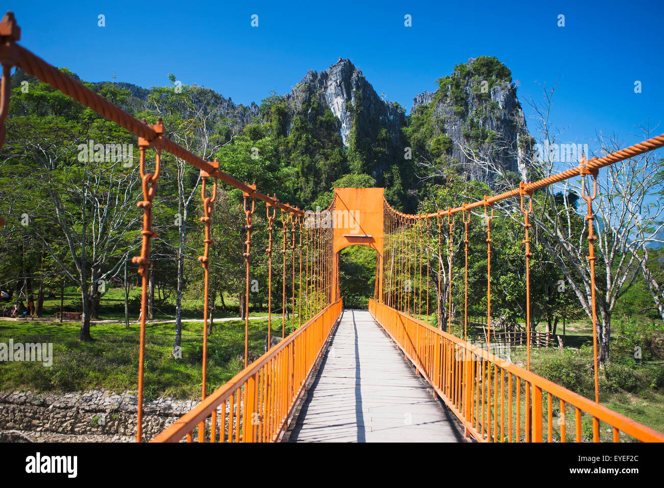 A bridge leads to caves outside of Vang Vieng; Laos Stock Photo