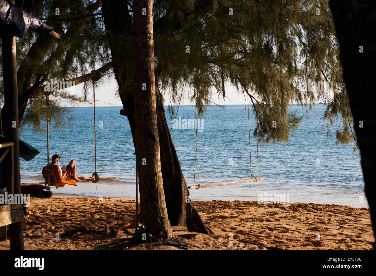 Relaxing on a beach swing; Bamboo Island, Cambodia Stock Photo