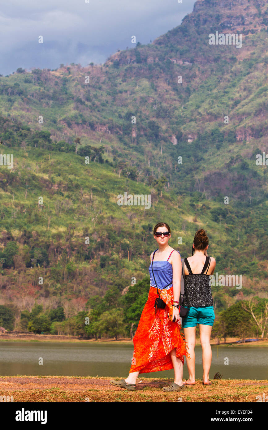 Young female tourists visiting Wat Phu temple; Wat Phu, Laos Stock Photo