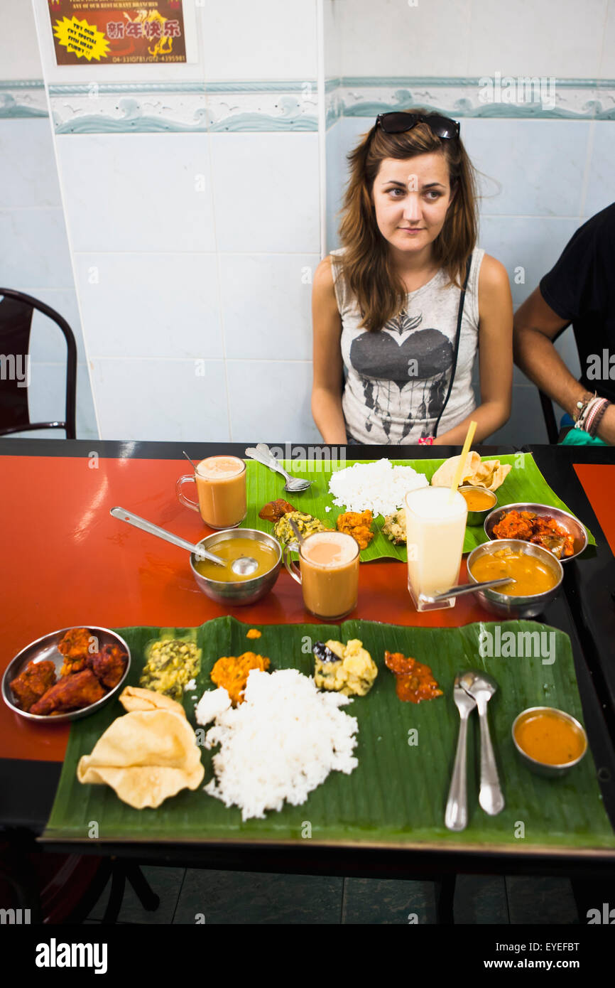 Eating Indian food at a local restaurant in the Little India