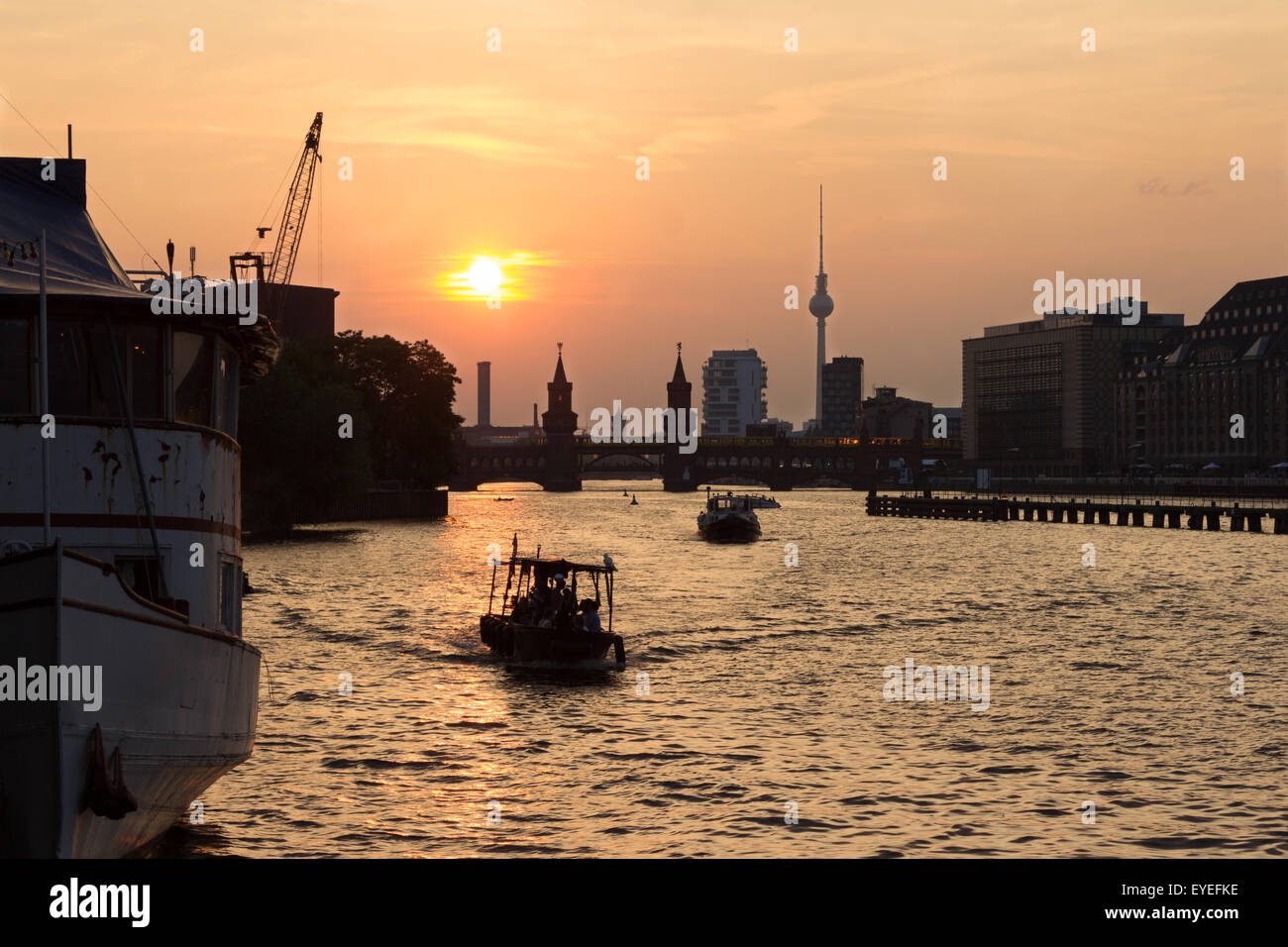 sunset over berlin , kreuzberg / spree , oberbaumbridge skyline Stock Photo