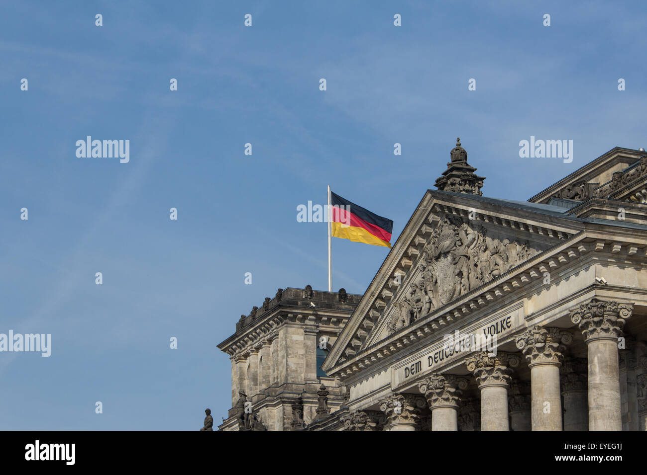 german flag on parliament building / Reichstag Stock Photo