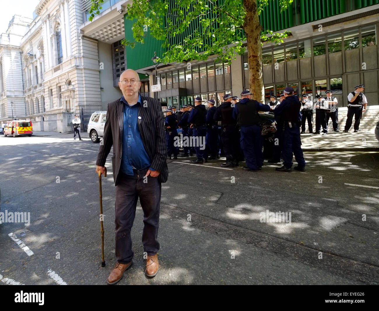 Members of Class War are escorted by Police from Parliament Sq during the State Opening of Parliament  Featuring: Atmosphere, Ian Bone, Police Where: London, United Kingdom When: 27 May 2015 C Stock Photo