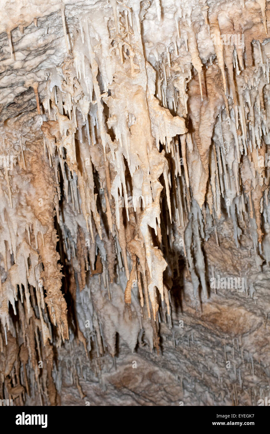 Stalactites and stalagmites in limestone cave. Stock Photo
