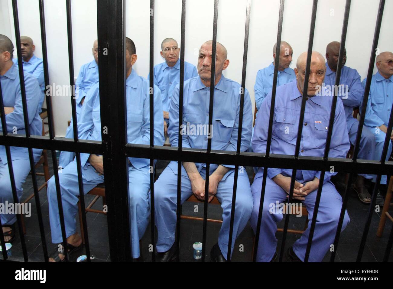 (150728) -- TRIPOLI, July 28, 2015 (Xinhua) -- Gaddafi-era officials wait for their trial in a prison cage in Tripoli, Libya, on July 28, 2015. A Libyan court on Tuesday sentenced Saif al-Islam Gaddafi, son of the former leader Muammar Gaddafi, to death, according to local judicial resources. The Tripoli-based court also ruled on eight other senior figures of the former government, including the former security chief, Abdullah al-Senussi. (Xinhua/Hamza Turkia) (djj) Stock Photo