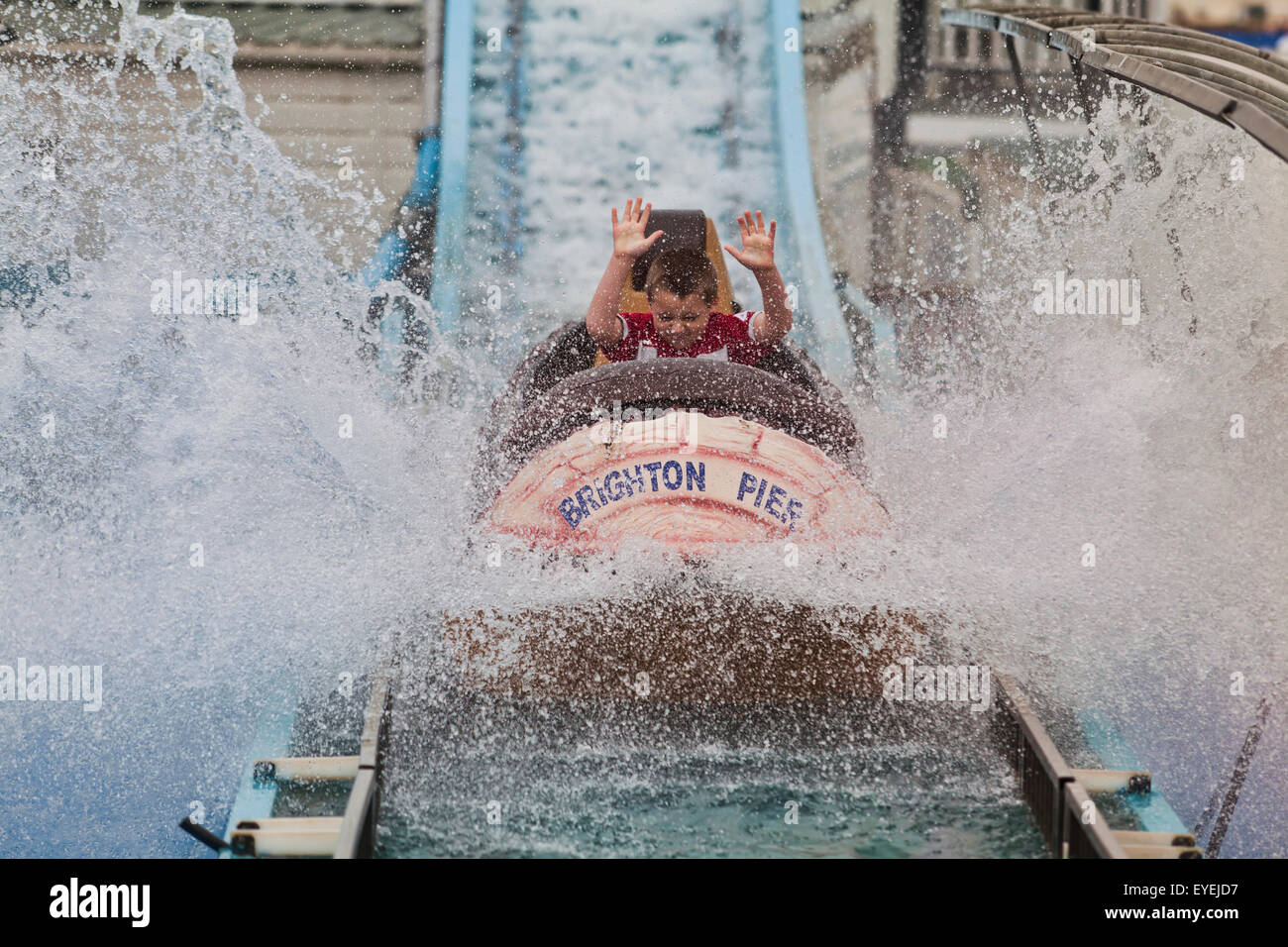 Boy on the log flume, Brighton Pier; Brighton, England Stock Photo