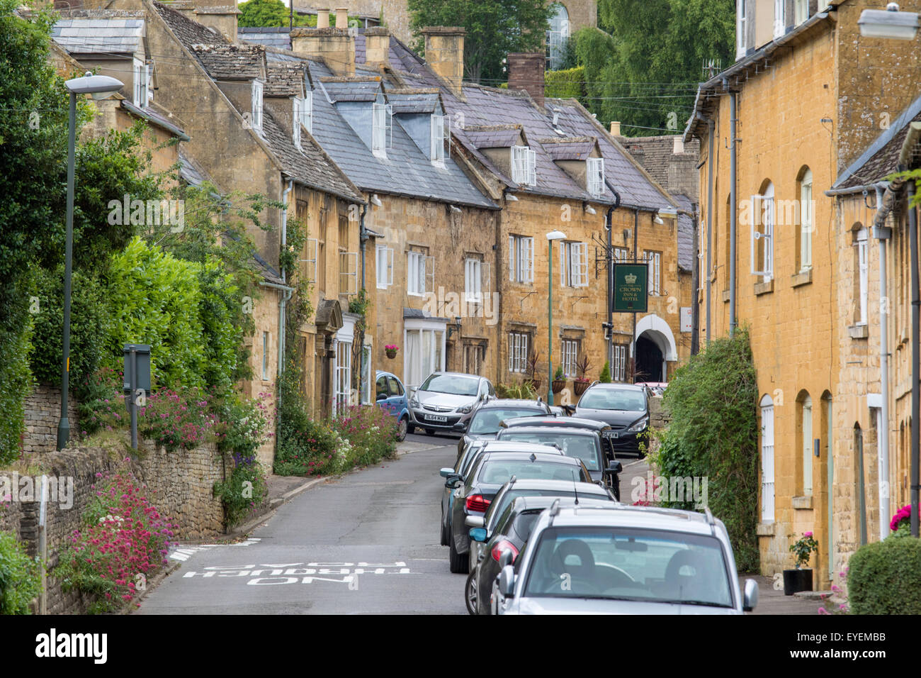 Cars parked in a Cotswold village street, England, UK Stock Photo Alamy