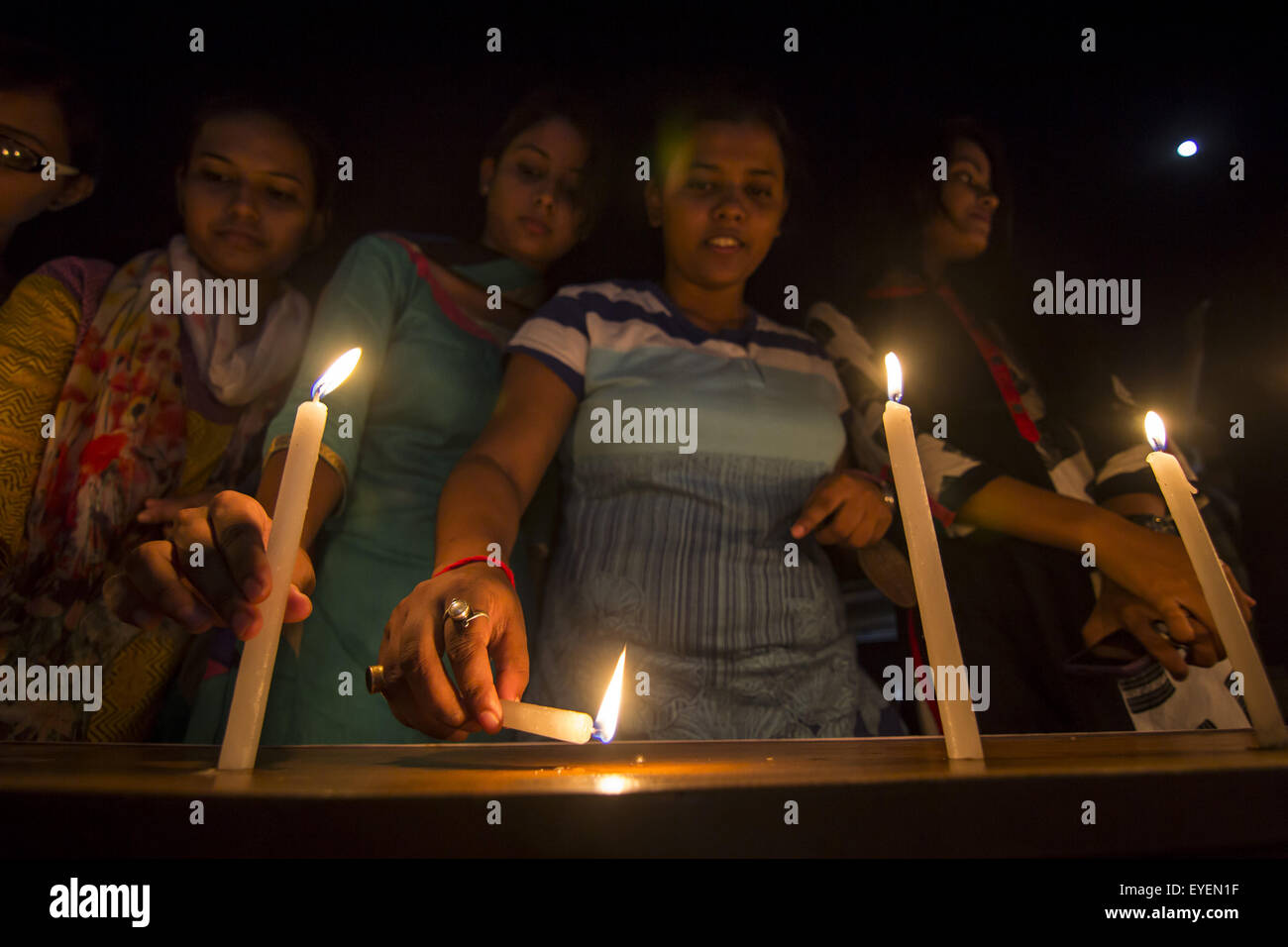 Sivasagar, Assam, India. 28th July, 2015. Indian girls light candles to pay homage to former President of India APJ Abdul Kalam in Sivasagar in northeastern Assam state on July 28, 2015. India's former president and top scientist A. P. J. Kalam, who played a lead role in the country's nuclear weapons tests, died on July 27, a hospital official said. He was 83. Kalam collapsed during a lecture at a management institute in the northeastern Indian city of Shillong, and was declared dead on arrival by doctors at Bethany hospital. © Luit Chaliha/ZUMA Wire/Alamy Live News Stock Photo