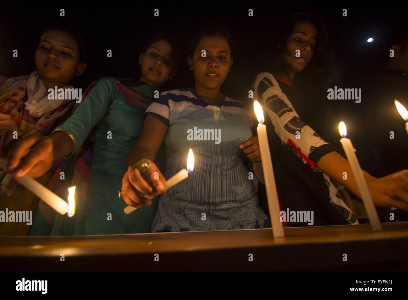 Sivasagar, Assam, India. 28th July, 2015. Indian girls light candles to pay homage to former President of India APJ Abdul Kalam in Sivasagar in northeastern Assam state on July 28, 2015. India's former president and top scientist A. P. J. Kalam, who played a lead role in the country's nuclear weapons tests, died on July 27, a hospital official said. He was 83. Kalam collapsed during a lecture at a management institute in the northeastern Indian city of Shillong, and was declared dead on arrival by doctors at Bethany hospital. © Luit Chaliha/ZUMA Wire/Alamy Live News Stock Photo