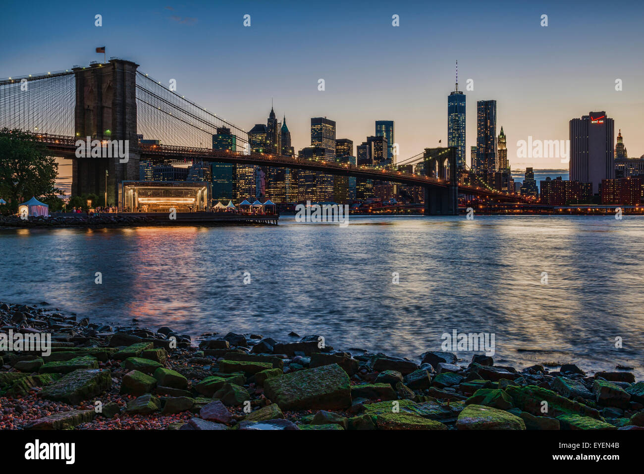 Manhattan skyline at twilight with Brooklyn Bridge, Brooklyn Bridge Park, Brooklyn; New York City, New York, USA Stock Photo