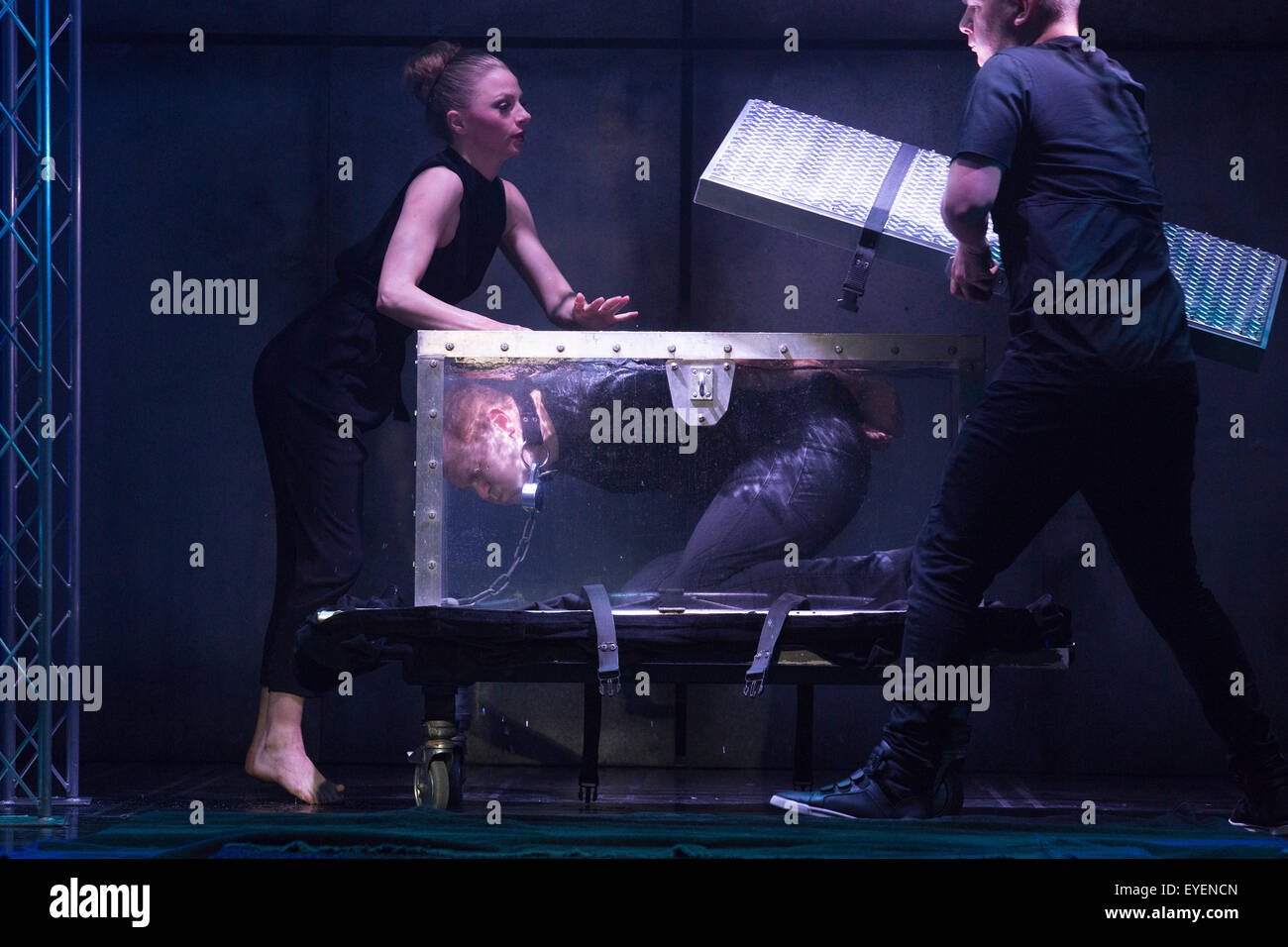 London, UK. 28 July 2015. Pictured. Escapology stunt with a water tank ...