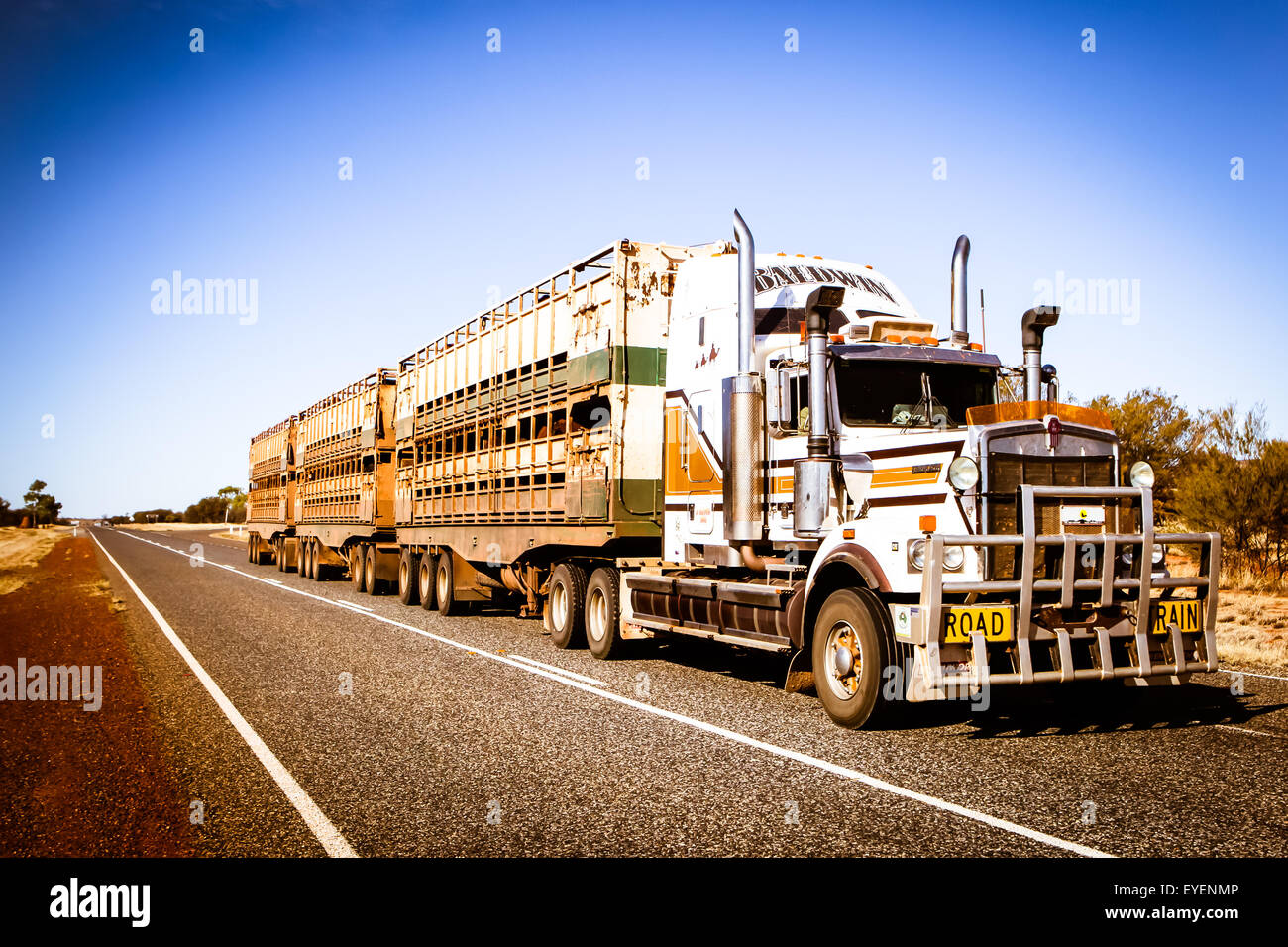 An iconic 3 trailer Australian road train travels along the Plenty Hwy near Gemtree in Northern Territory, Australia Stock Photo