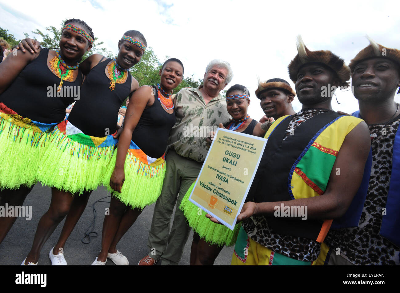 Czech director of animal cartoons Vaclav Chaloupek (center) and IYASA music  and dance group from art school in Bulawayo in Zimbabwe accompanied giving  names for two mares of Hartmann's mountain zebra (Equus