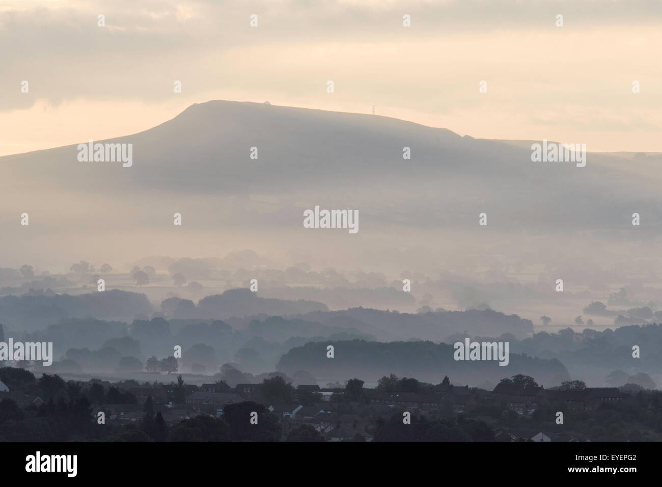 Titterstone Clee Hill overlooking Ludlow on a misty morning, Shropshire