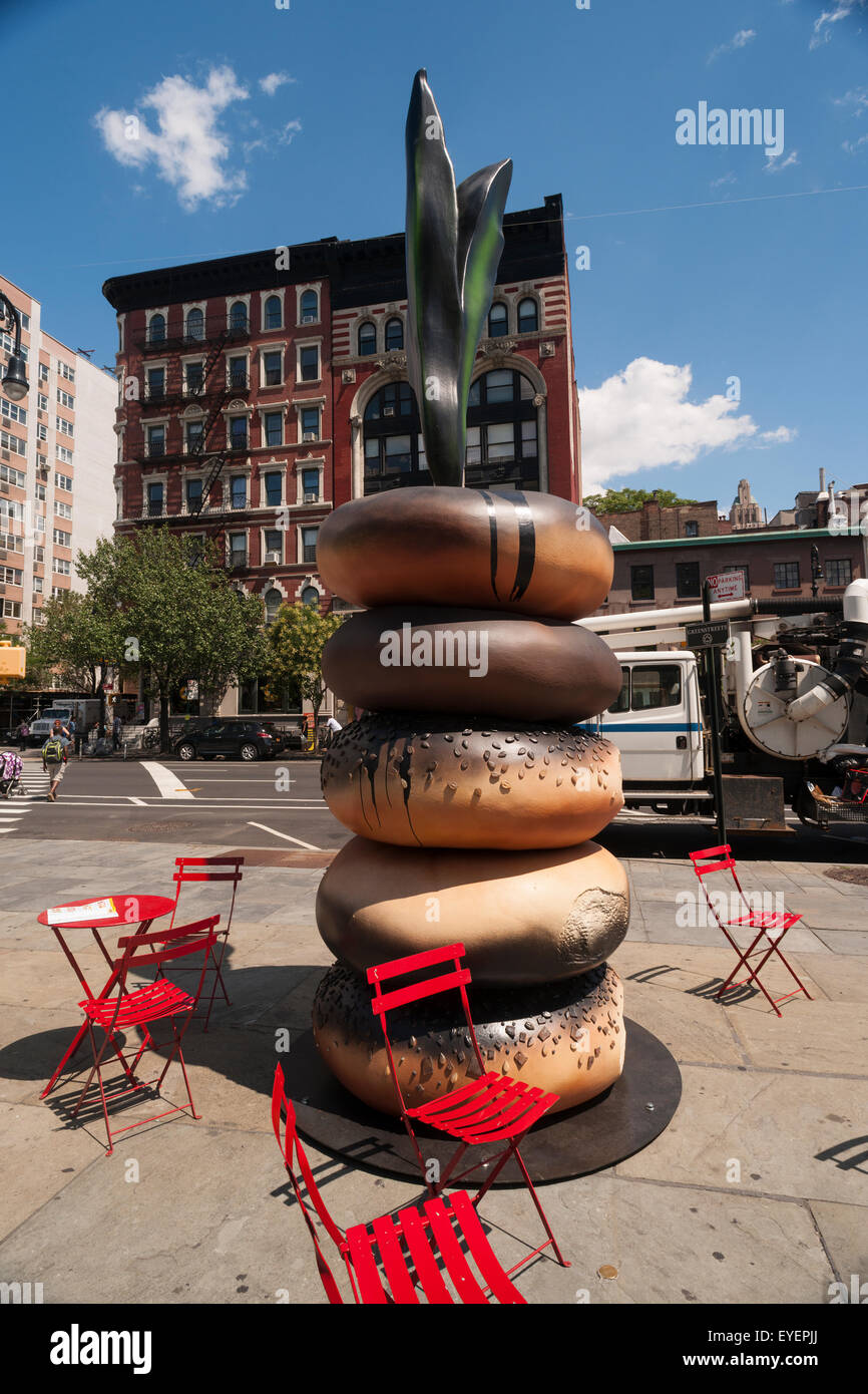 "Everything" by the  artist Hanna Liden is on view in Ruth Wittenberg Triangle in Greenwich Village in New York on Wednesday, July 22, 2015. The styrene and polyurethane sculptures are on view in Wittenberg Triangle and Hudson River Park. The Swedish artist discovered bagels upon her move to New York in 1998 and considers them an "icon of urban living". The art will be on view until Aug. 24 and Oct. 20 respectively.  (© Richard B. Levine) Stock Photo