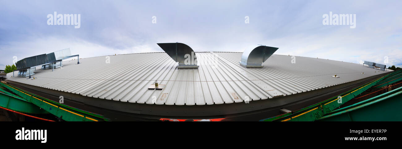 Stitched panorama of roof extract unit on industrial building roof Stock Photo
