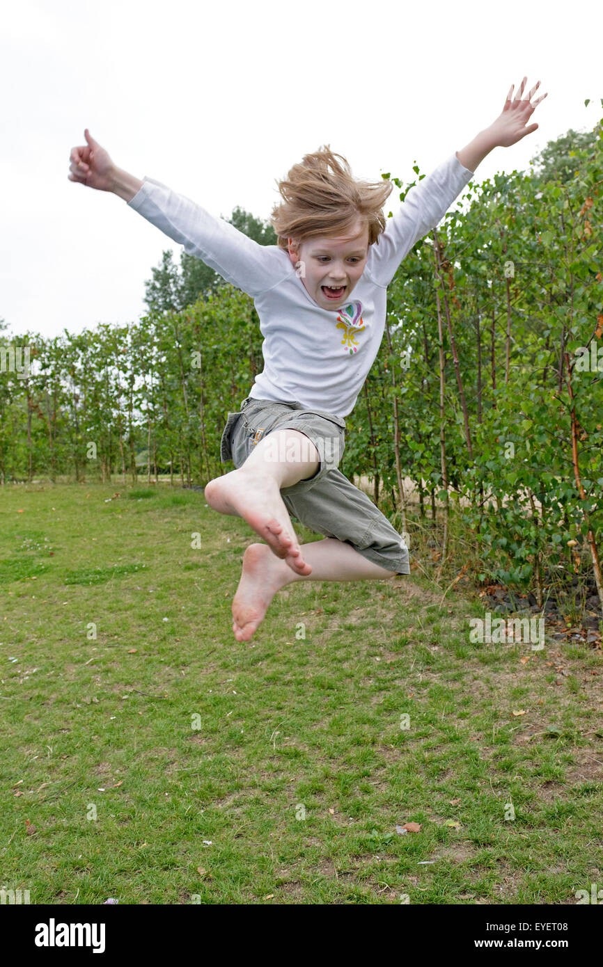 young boy doing a karate jump Stock Photo