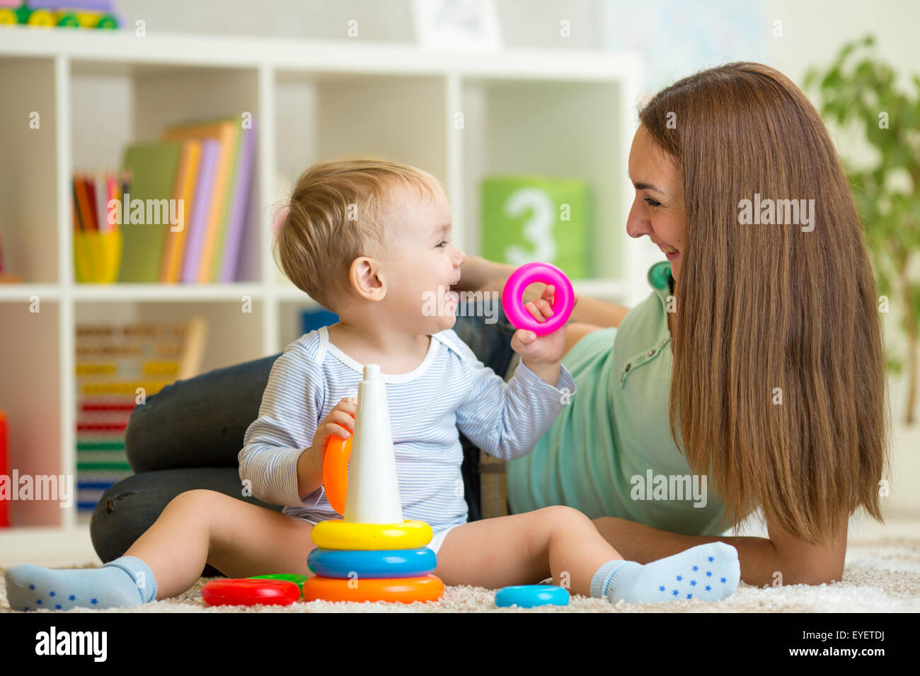 cute mother and baby boy play together indoor at home Stock Photo - Alamy