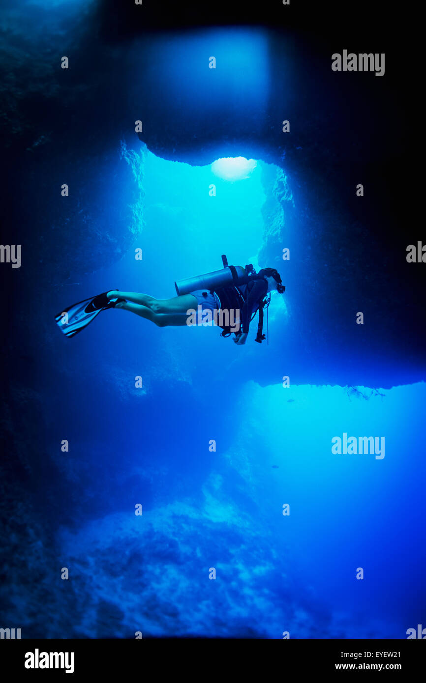 Diving into the Blue Holes underwater caves; Palau, Micronesia Stock Photo