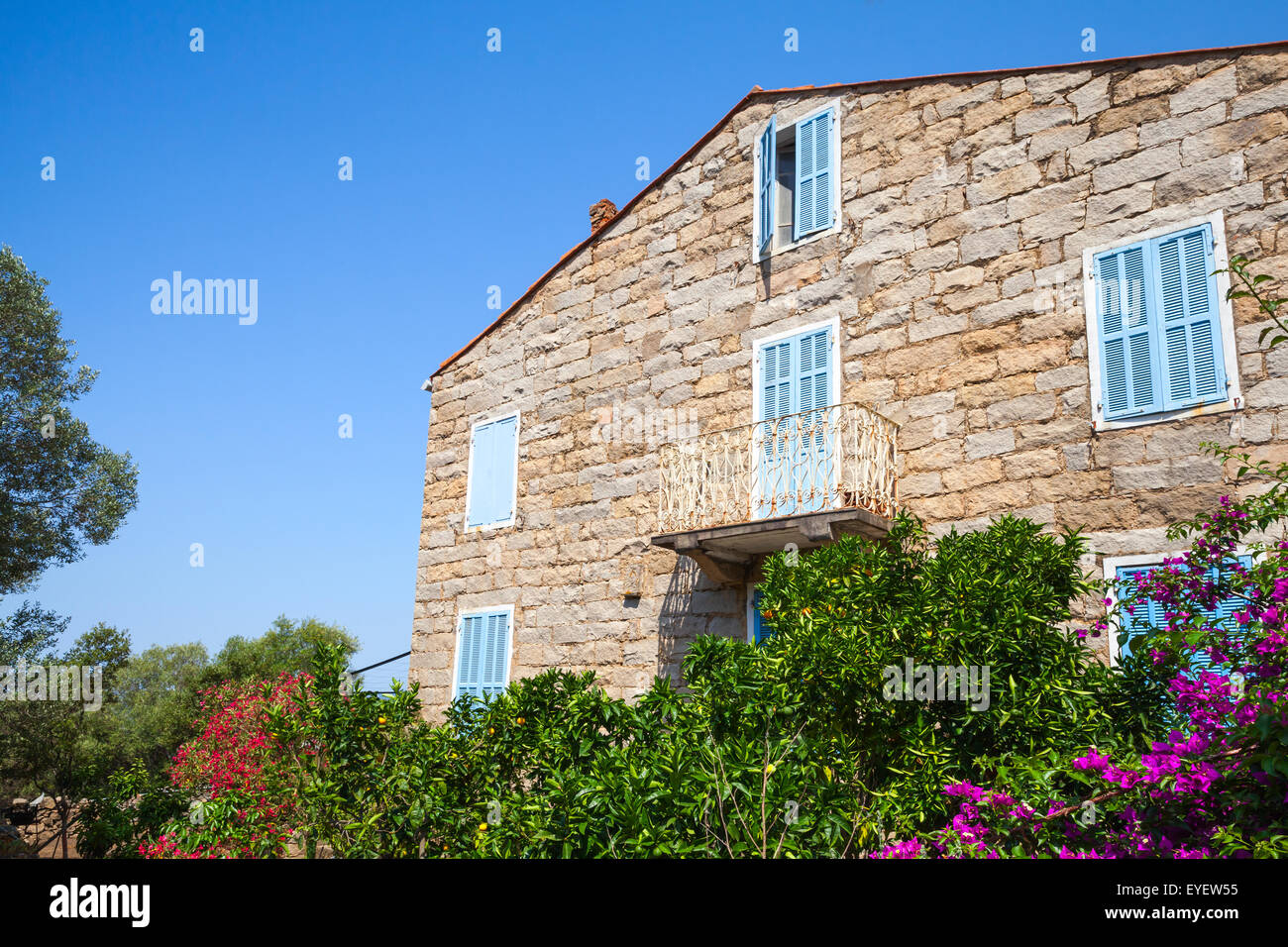 Old stone living house facade fragment, Figari town, Corsica island, France Stock Photo