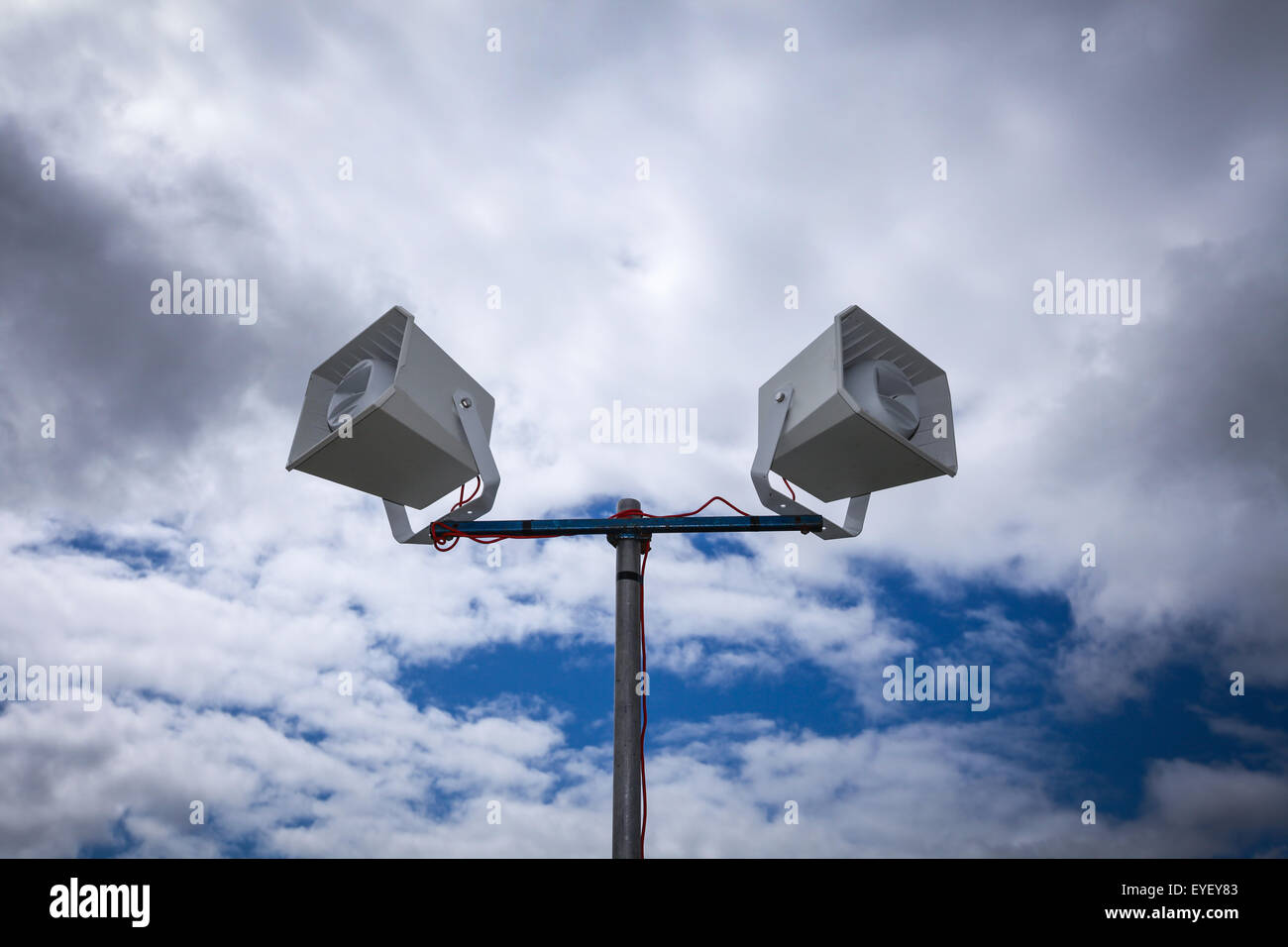 public address system PA system in front of a dramatic cloudy sky Stock Photo