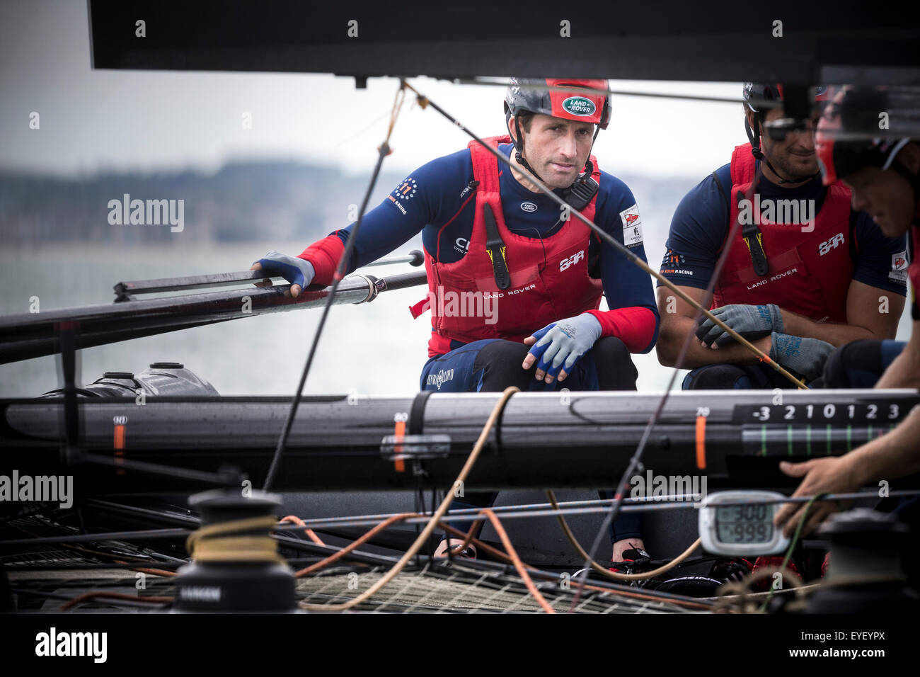 Sir Ben Ainslie at the helm of his AC45 foiling catamaran Land Rover BAR in Portsmouth at the start of the America's Cup World S Stock Photo