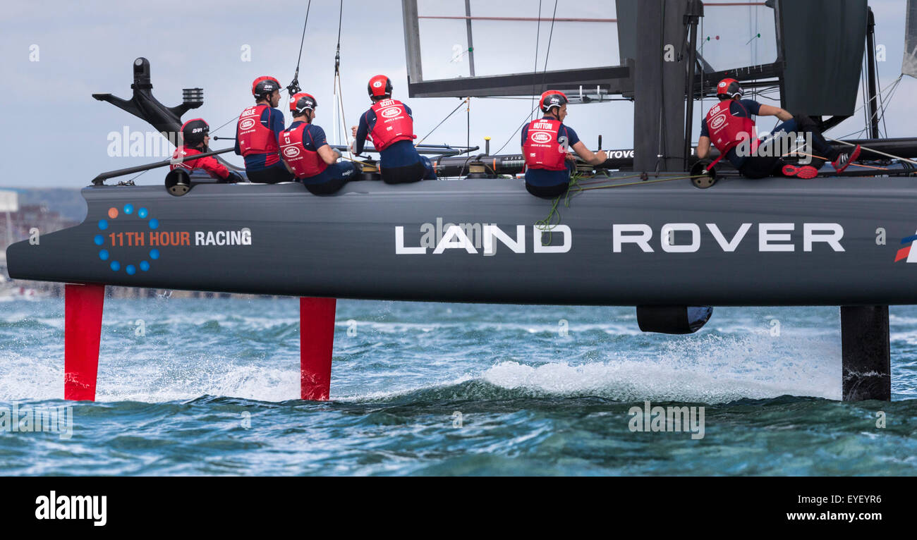 Sir Ben Ainslie (second from left) at the helm of his AC45 foiling catamaran Land Rover BAR in Portsmouth at the start of the Am Stock Photo