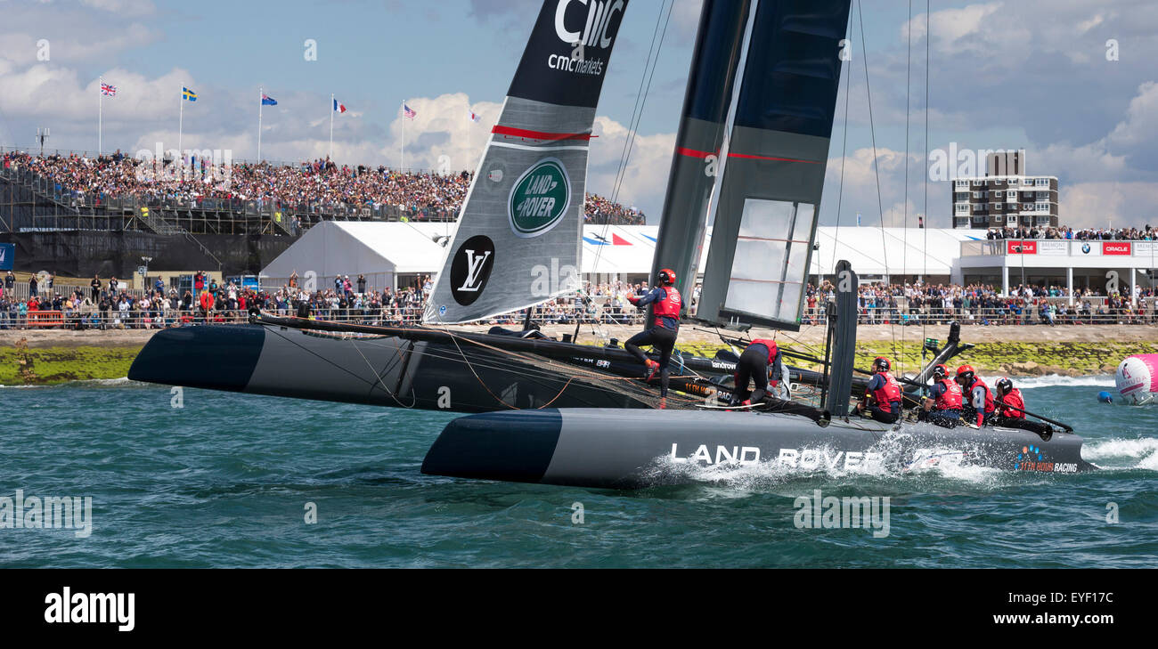 Sir Ben Ainslie wins the first race aboard his AC45 foiling catamaran on the Solent off Portsmouth during the first r Stock Photo