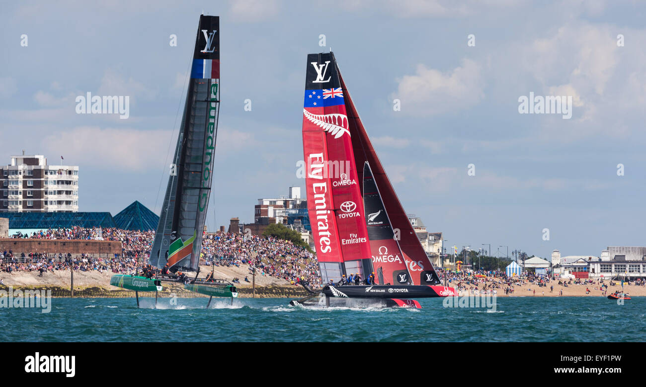 The AC45 foiling catamarans of Groupama Team France and Emirates Team New Zealand performing on the Solent Stock Photo