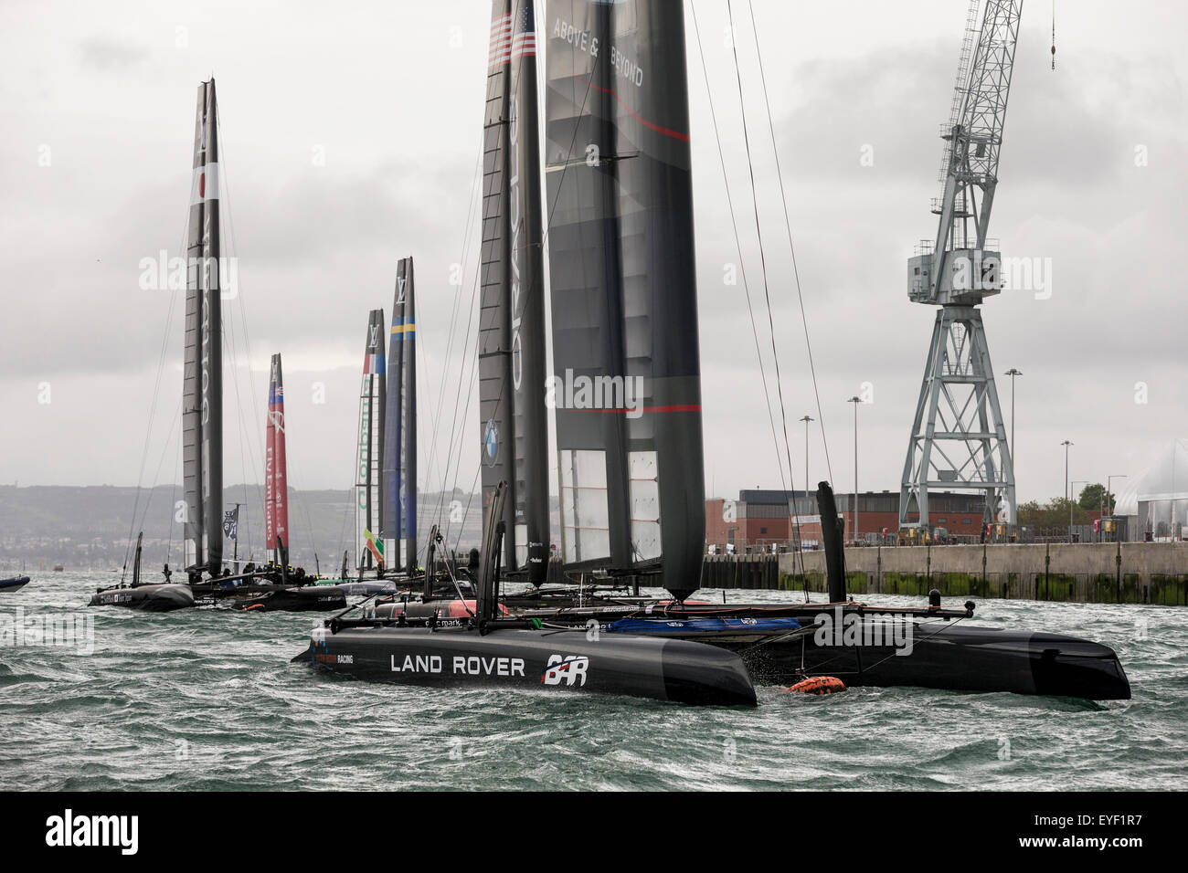 The six AC45 foiling catamarans of the America's Cup World Series sit in the relative safety of Portsmouth Harbour as Stock Photo