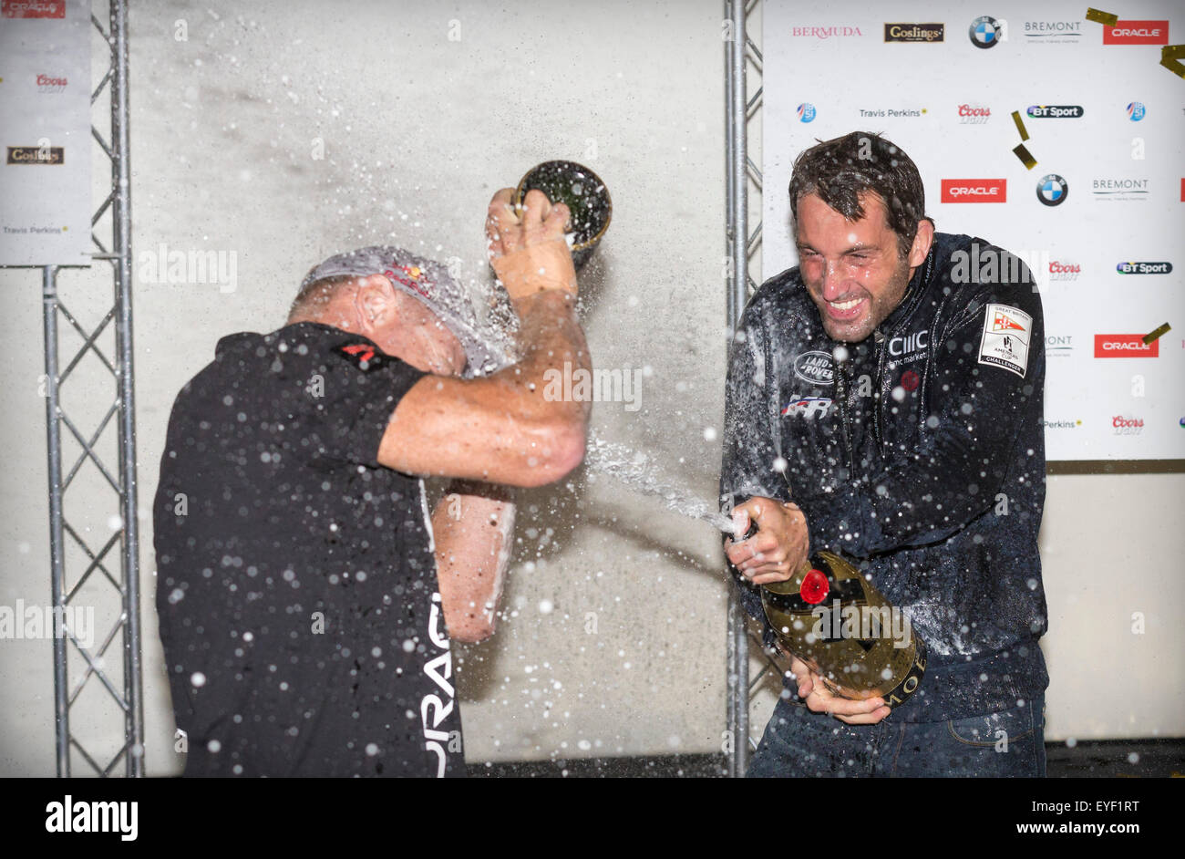 Sir Ben Ainslie (right) and sailing rival Jimmy Spithill, skipper of the Oracle Team USA, cover each other in champagne Stock Photo