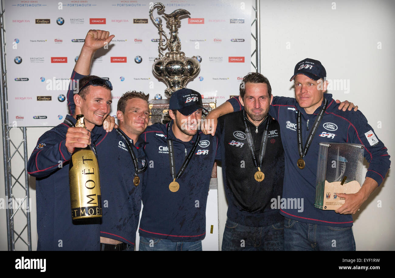 Covered in champagne, Sir Ben Ainslie (fourth from left) poses with members of his sailing team after winning the LVACWS Stock Photo