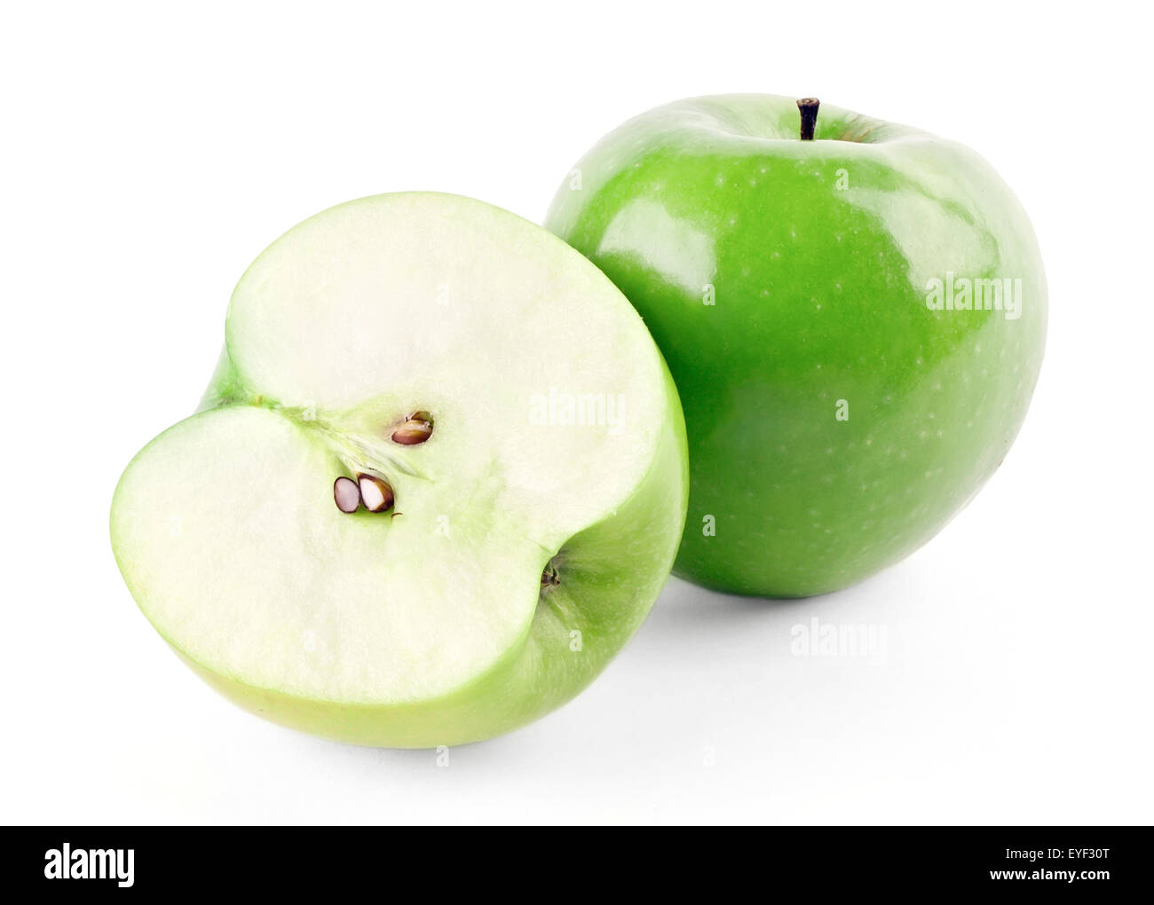 Green ripe apple and half isolated on white background Stock Photo - Alamy