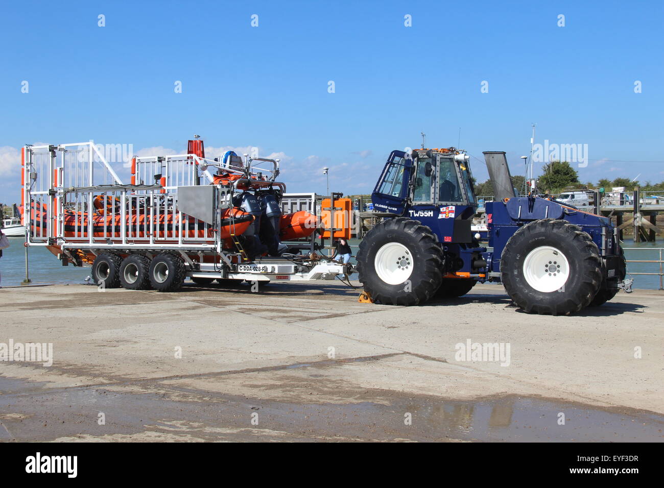 RNLI inshore lifeboat on trailer with tractor at Rye Harbour East Sussex England UK Stock Photo